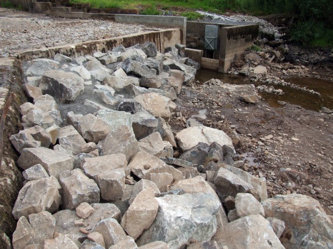 The boulder died designed to guide fish to the bottom of the ladder and deter them from going over the weir.