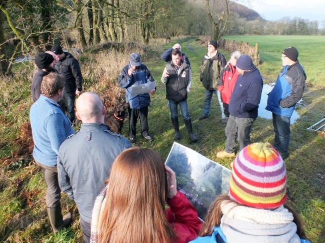 A group of attended discussing the effectiveness of control methods on the banks of the Luce