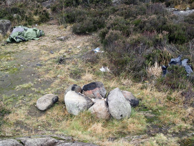 A tent left behind after a camping trip. Beer cans and bottles litter the area. If this is what Land Reform encourages, then I for one don't want more freedom for the masses. Where's the respect?