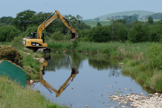 The advantage of using a large excavator was that boulders were placed either from the bank or dry gravel bars.