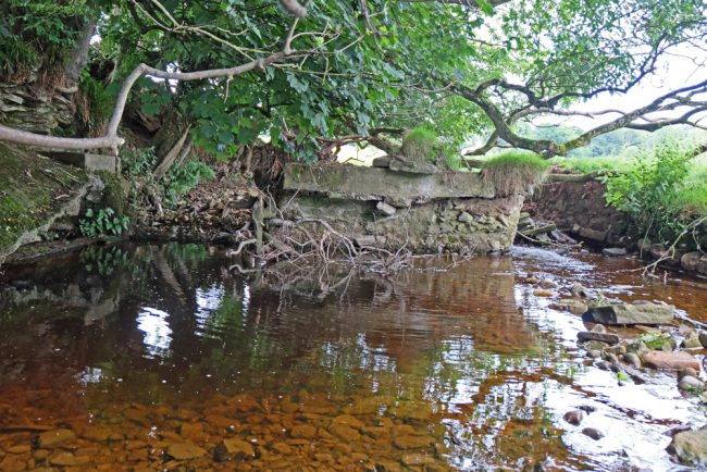 Floods scoured around this old weir and it would be better to remove this than leave it in place.